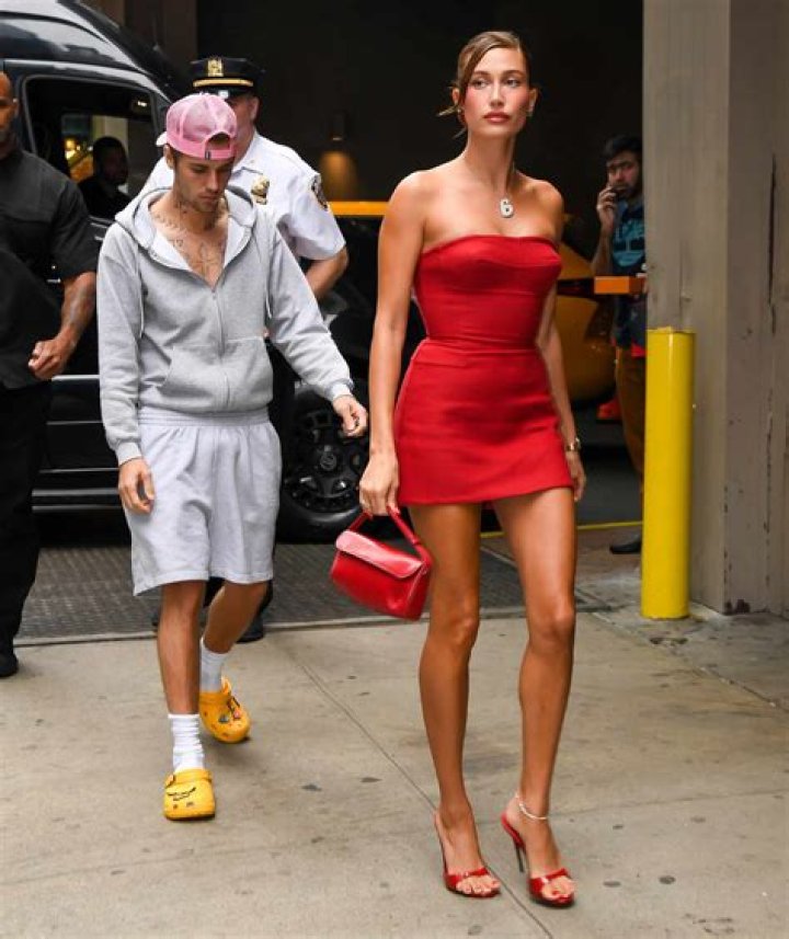 Hailey Bieber in a shimmery nude dress that hugs her flawless figure
