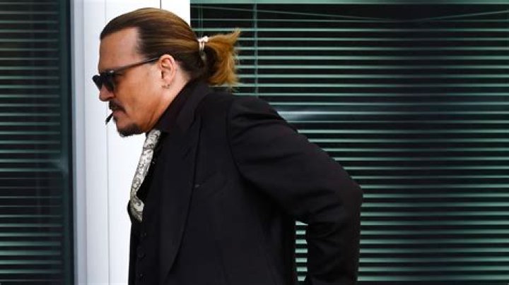 Johnny Depp disputes context of unflattering photo of himself being unconscious taken by ex-wife Amber Heard amid trial