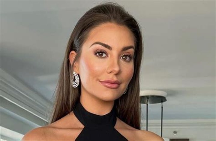 Kelley Flanagan Shares Swimsuit Photo Saying "Visit Greece" —