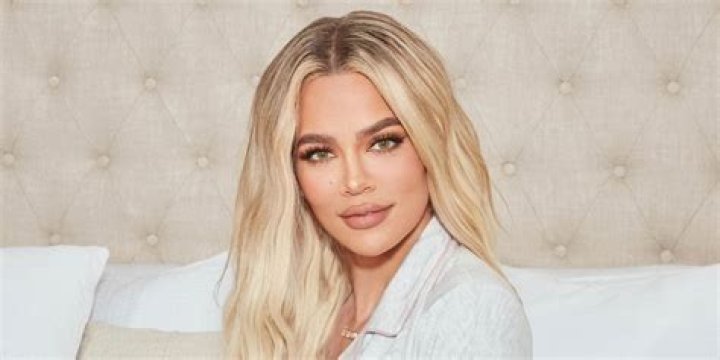 Khloe Kardashian, in a dress with a defiantly transparent skirt