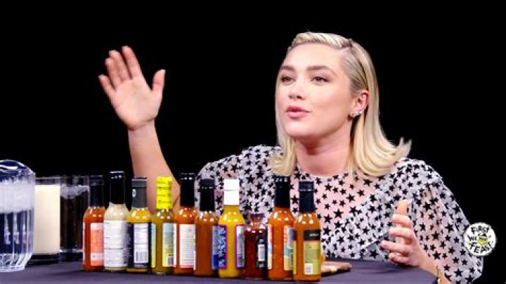 Take some time to enjoy Florence Pugh sweating from her eyebrows while eating hot wings