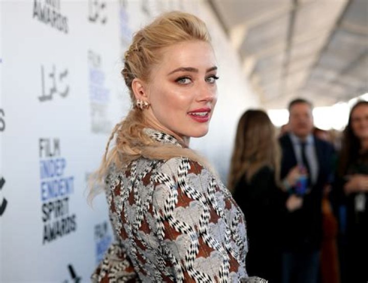 Why does Amber Heard have a British accent?